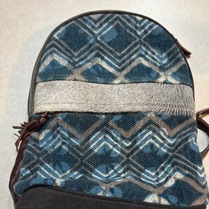 Geometric Pattern Backpack with Blue and Brown Accents